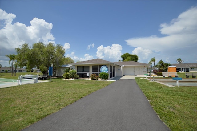 12538 SW Kingsway Cir Unit 1602, Lake Suzy, FL 34269 - ranch-style home with an attached garage, a front lawn, and driveway