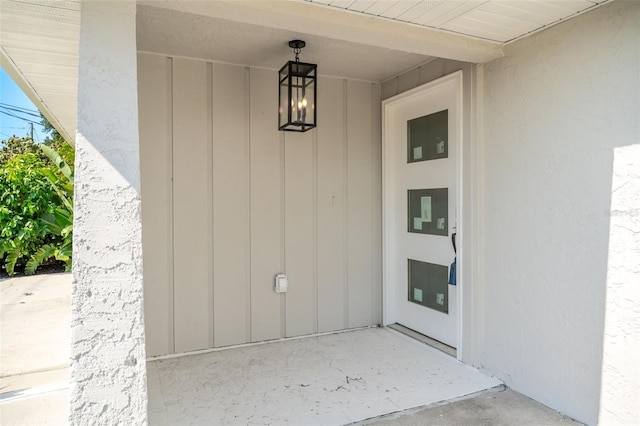 1231 Beacon Dr, Port Charlotte, FL 33952 - view of exterior entry featuring board and batten siding