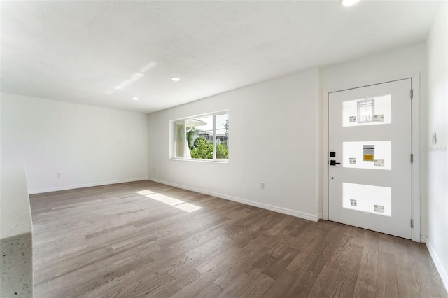 1231 Beacon Dr, Port Charlotte, FL 33952 - entrance foyer featuring wood finished floors, recessed lighting, and baseboards