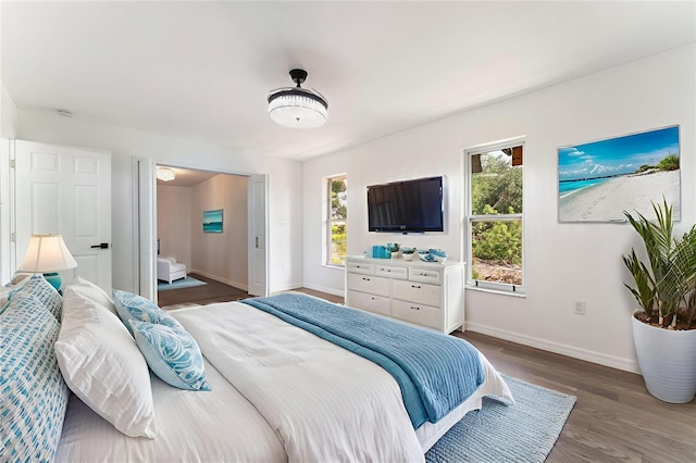 1231 Beacon Dr, Port Charlotte, FL 33952 - bedroom featuring baseboards and wood finished floors