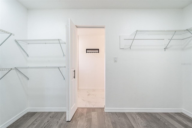 1231 Beacon Dr, Port Charlotte, FL 33952 - spacious closet featuring wood finished floors