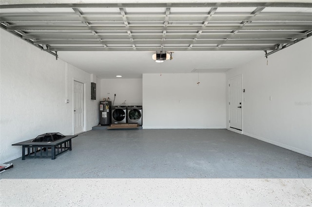1231 Beacon Dr, Port Charlotte, FL 33952 - garage featuring washer and clothes dryer, electric water heater, a garage door opener, and electric panel