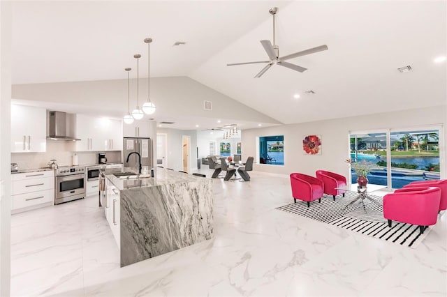 261 Venezia Ct, Punta Gorda, FL 33950 - living room featuring light marble finish floors, a ceiling fan, plenty of natural light, high vaulted ceiling, and recessed lighting