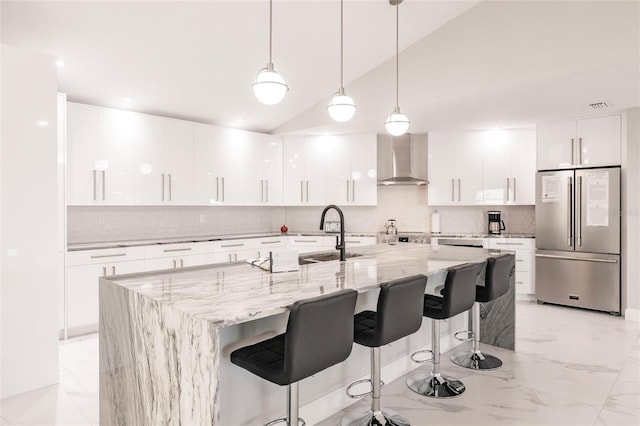 261 Venezia Ct, Punta Gorda, FL 33950 - kitchen with high end fridge, wall chimney exhaust hood, modern cabinets, tasteful backsplash, and recessed lighting