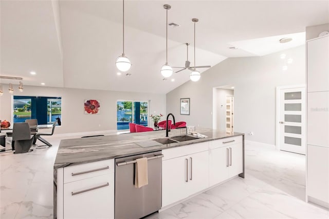 261 Venezia Ct, Punta Gorda, FL 33950 - kitchen featuring stainless steel dishwasher, a sink, light marble finish flooring, lofted ceiling, and light stone counters