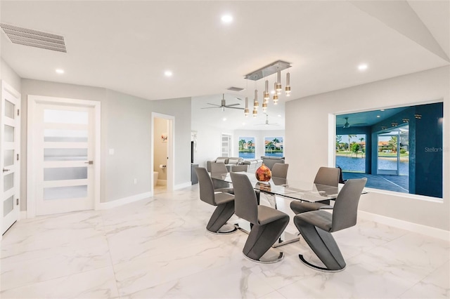 261 Venezia Ct, Punta Gorda, FL 33950 - dining space featuring recessed lighting, marble finish flooring, a ceiling fan, and baseboards