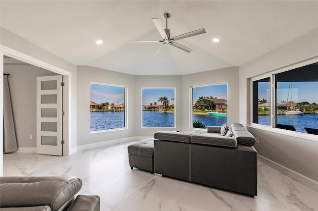 261 Venezia Ct, Punta Gorda, FL 33950 - living area with light marble finish floors, a water view, baseboards, recessed lighting, and ceiling fan