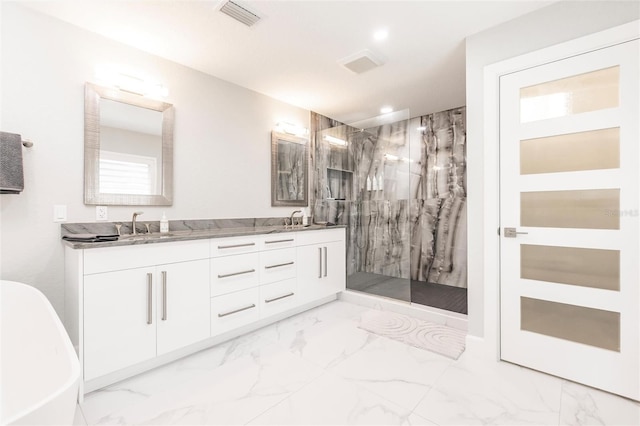 261 Venezia Ct, Punta Gorda, FL 33950 - bathroom with a marble finish shower, marble finish flooring, a soaking tub, double vanity, and recessed lighting