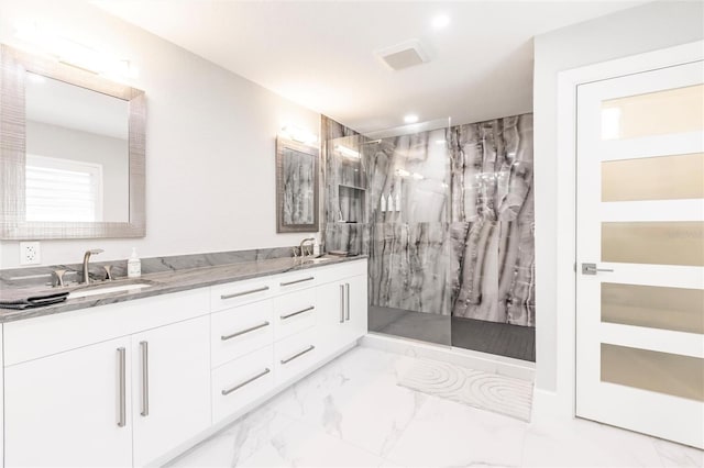 261 Venezia Ct, Punta Gorda, FL 33950 - full bathroom featuring marble look tiles, a marble finish shower, double vanity, and recessed lighting