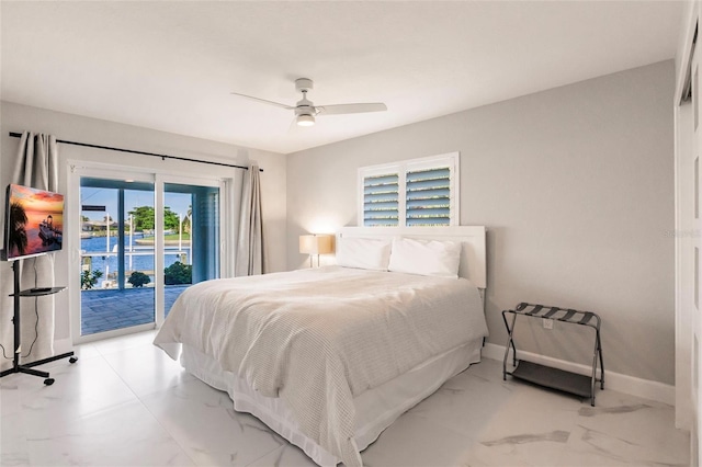 261 Venezia Ct, Punta Gorda, FL 33950 - bedroom with access to outside, marble look tile flooring, baseboards, and a ceiling fan