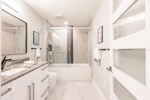 261 Venezia Ct, Punta Gorda, FL 33950 - bathroom with vanity, toilet, marble finish floors, bath / shower combo with glass door, and a textured ceiling