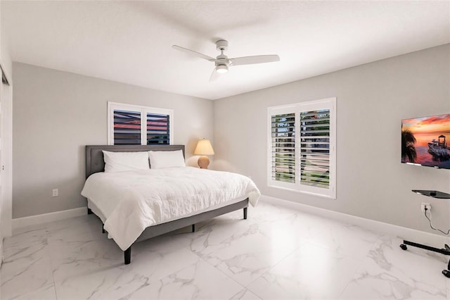 261 Venezia Ct, Punta Gorda, FL 33950 - bedroom featuring baseboards, marble look tiles, and a ceiling fan