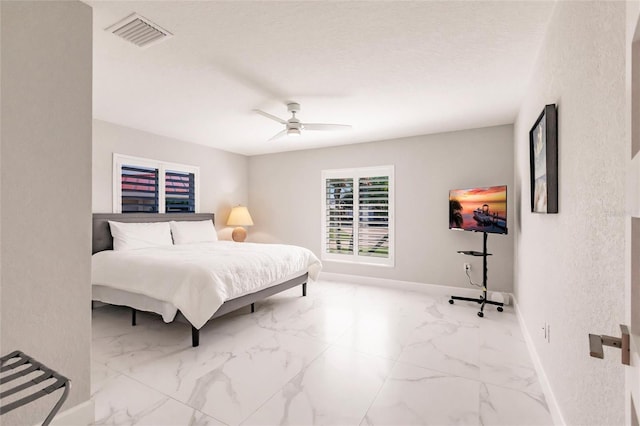 261 Venezia Ct, Punta Gorda, FL 33950 - bedroom featuring baseboards, marble look tiles, and ceiling fan