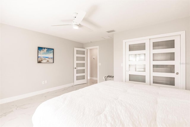 261 Venezia Ct, Punta Gorda, FL 33950 - bedroom featuring marble finish flooring, baseboards, a ceiling fan, and a closet