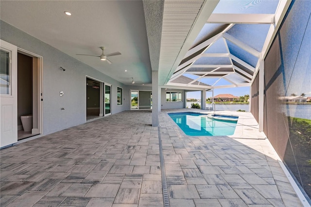 261 Venezia Ct, Punta Gorda, FL 33950 - view of pool featuring a patio area, a ceiling fan, a pool with connected hot tub, and glass enclosure