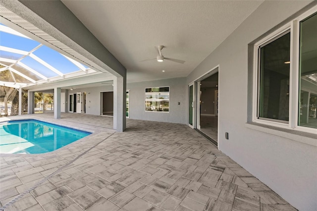 261 Venezia Ct, Punta Gorda, FL 33950 - outdoor pool with a patio area, ceiling fan, and glass enclosure