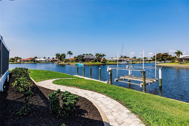 261 Venezia Ct, Punta Gorda, FL 33950 - dock featuring boat lift, a residential view, a water view, and a lawn
