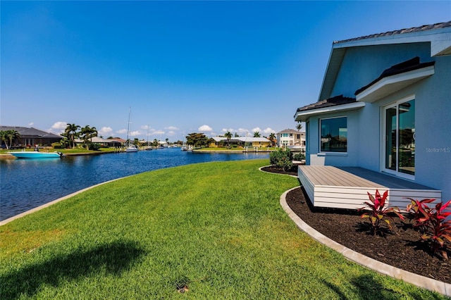 261 Venezia Ct, Punta Gorda, FL 33950 - view of grassy yard featuring a residential view and a deck with water view