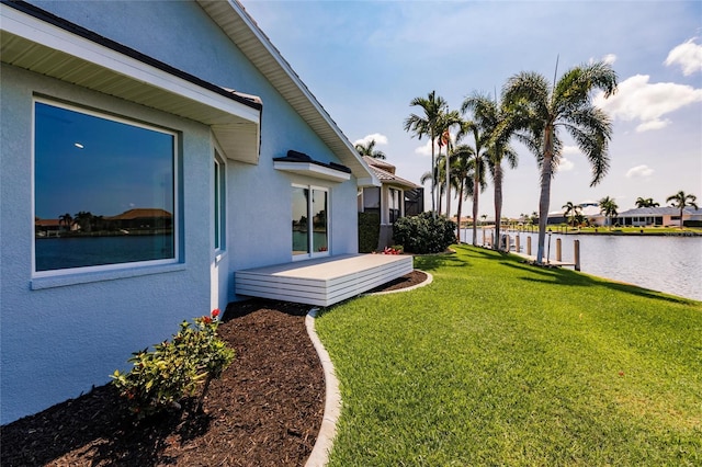 261 Venezia Ct, Punta Gorda, FL 33950 - view of green lawn with a deck with water view