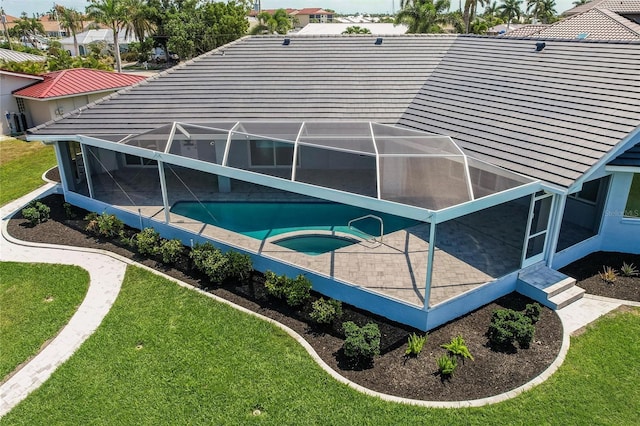 261 Venezia Ct, Punta Gorda, FL 33950 - view of pool featuring a lawn, a lanai, a patio, and a pool with connected hot tub