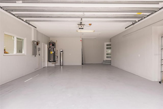 261 Venezia Ct, Punta Gorda, FL 33950 - garage featuring water heater, a garage door opener, and electric panel