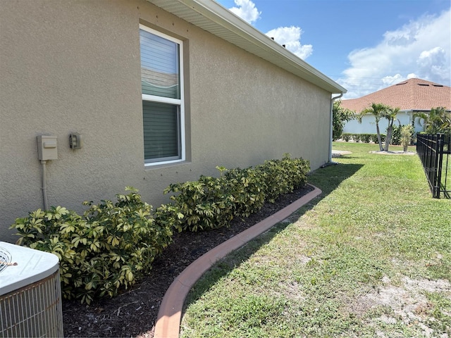 25008 Lalique Pl, Punta Gorda, FL 33950 - view of side of property with central air condition unit and stucco siding