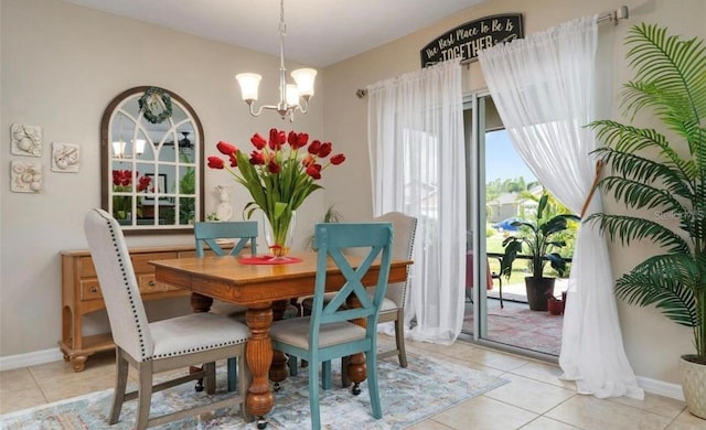 25008 Lalique Pl, Punta Gorda, FL 33950 - dining area with a chandelier, light tile patterned flooring, and baseboards
