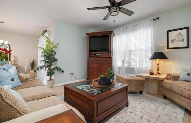 25008 Lalique Pl, Punta Gorda, FL 33950 - living area with ceiling fan and a chandelier