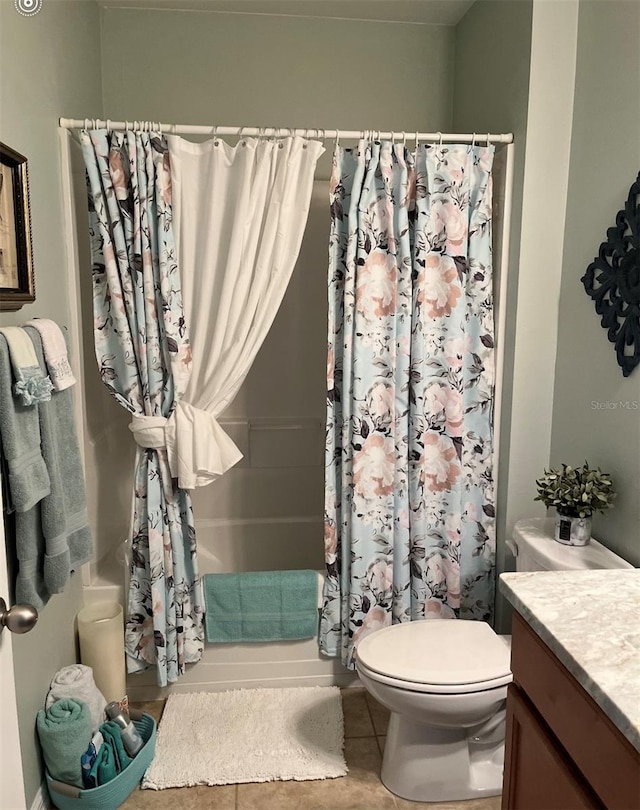 25008 Lalique Pl, Punta Gorda, FL 33950 - bathroom with toilet, vanity, shower / tub combo, and tile patterned floors