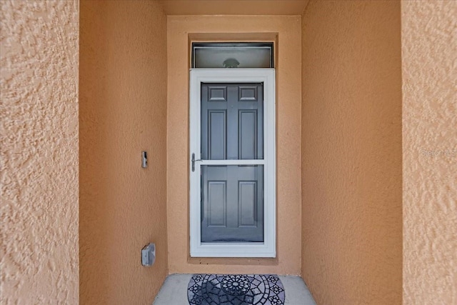 7652 Mikasa Dr, Punta Gorda, FL 33950 - entrance to property featuring stucco siding