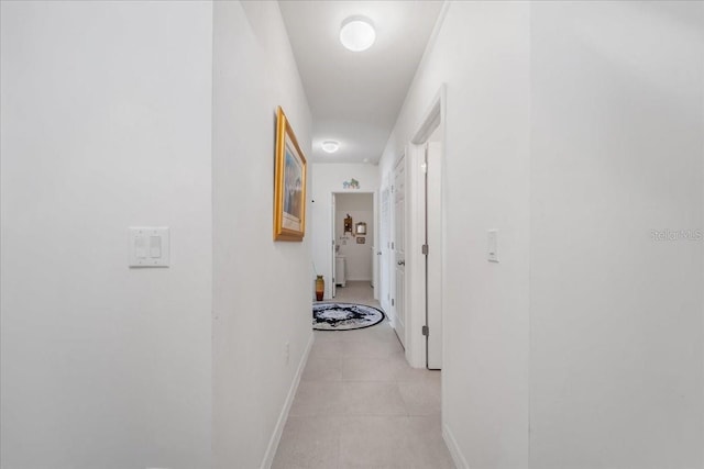 7652 Mikasa Dr, Punta Gorda, FL 33950 - hallway with baseboards and light tile patterned floors