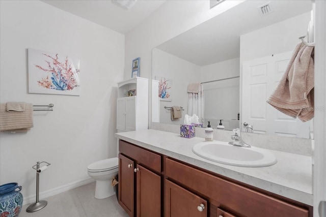 7652 Mikasa Dr, Punta Gorda, FL 33950 - bathroom with toilet, vanity, a shower with shower curtain, tile patterned flooring, and baseboards