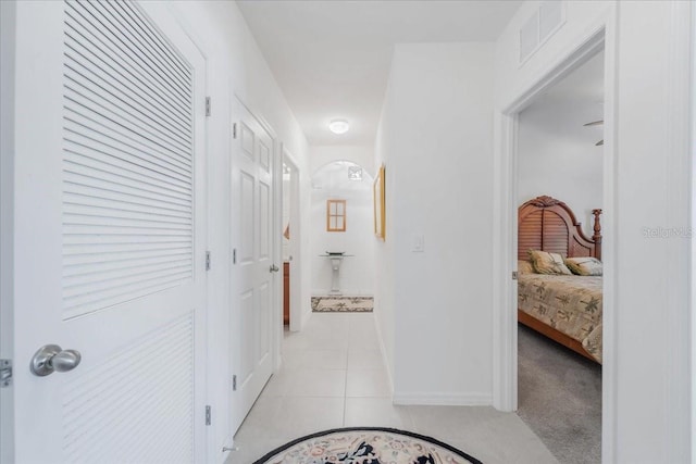 7652 Mikasa Dr, Punta Gorda, FL 33950 - corridor with light tile patterned flooring and baseboards
