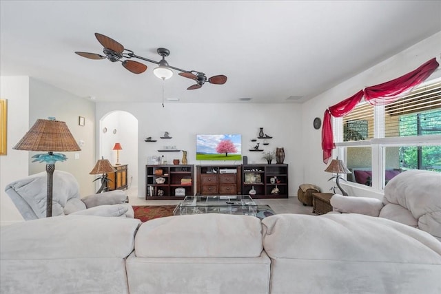 7652 Mikasa Dr, Punta Gorda, FL 33950 - living room with a ceiling fan and arched walkways