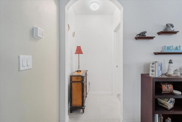 7652 Mikasa Dr, Punta Gorda, FL 33950 - hall with arched walkways and baseboards