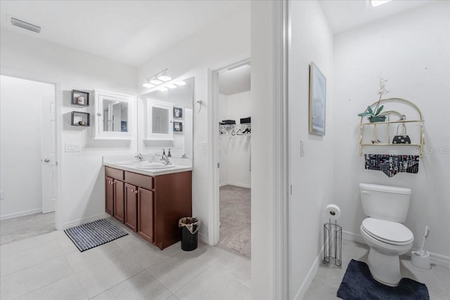 7652 Mikasa Dr, Punta Gorda, FL 33950 - bathroom with vanity, baseboards, toilet, and tile patterned flooring