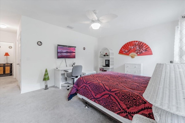 7652 Mikasa Dr, Punta Gorda, FL 33950 - bedroom featuring carpet floors, arched walkways, and a ceiling fan