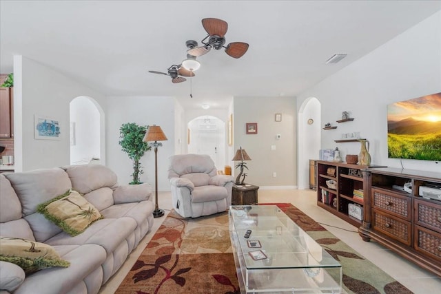 7652 Mikasa Dr, Punta Gorda, FL 33950 - living room with arched walkways and a ceiling fan