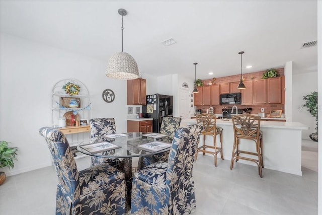 7652 Mikasa Dr, Punta Gorda, FL 33950 - dining space featuring recessed lighting, light tile patterned floors, and baseboards