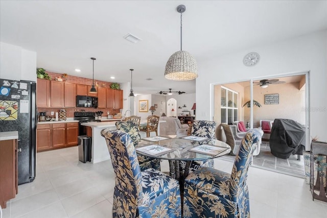 7652 Mikasa Dr, Punta Gorda, FL 33950 - dining room with light tile patterned floors, a ceiling fan, and recessed lighting