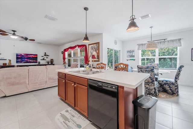 7652 Mikasa Dr, Punta Gorda, FL 33950 - kitchen with dishwasher, light tile patterned flooring, light countertops, and hanging light fixtures