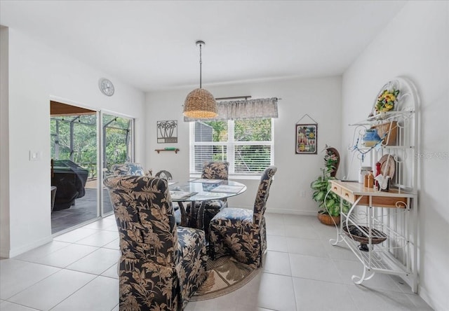 7652 Mikasa Dr, Punta Gorda, FL 33950 - dining room featuring light tile patterned floors and baseboards