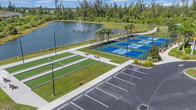 7652 Mikasa Dr, Punta Gorda, FL 33950 - view of community featuring uncovered parking, a tennis court, a water view, and a game area