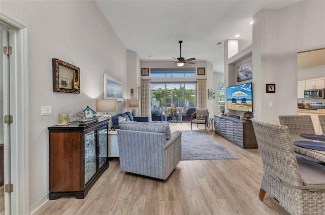 24358 Folkstone Ave, Punta Gorda, FL 33980 - living area featuring light wood-style flooring and a ceiling fan