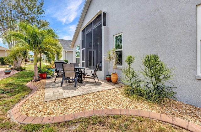 24358 Folkstone Ave, Punta Gorda, FL 33980 - view of patio with a sunroom and outdoor dining space