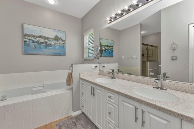 24358 Folkstone Ave, Punta Gorda, FL 33980 - full bathroom featuring a bath, double vanity, tile patterned floors, and a shower stall