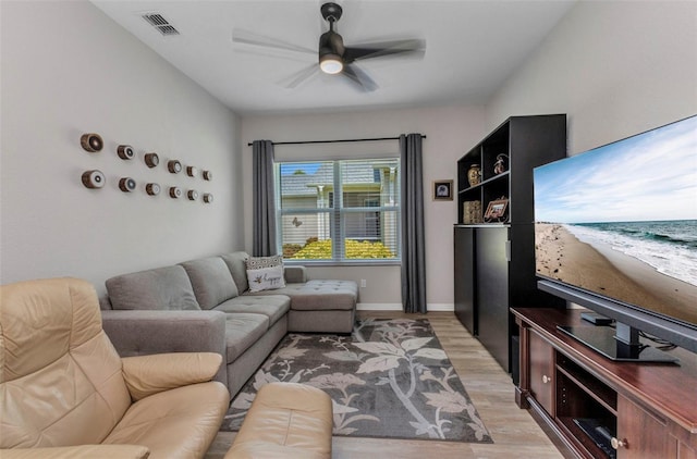 24358 Folkstone Ave, Punta Gorda, FL 33980 - living room with light wood-style flooring, ceiling fan, and baseboards