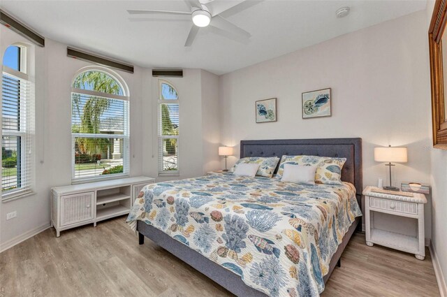 24358 Folkstone Ave, Punta Gorda, FL 33980 - bedroom with wood finished floors, baseboards, and ceiling fan