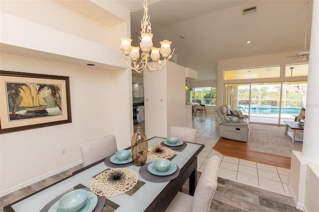 3506 Saint Florent Ct, Punta Gorda, FL 33950 - dining space featuring tile patterned floors, a chandelier, and ceiling fan