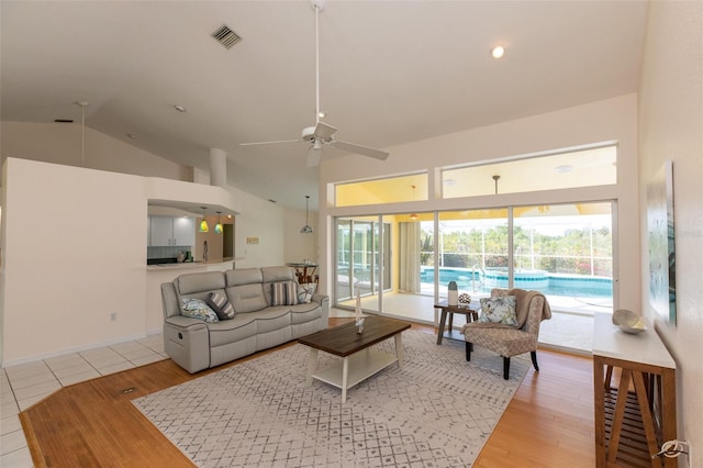 3506 Saint Florent Ct, Punta Gorda, FL 33950 - living area featuring ceiling fan, healthy amount of natural light, high vaulted ceiling, and wood finished floors